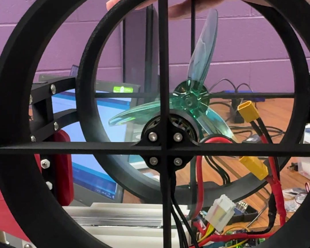 One of the bike's 3D-printed ducts with its green propeller, held during the first thrust test